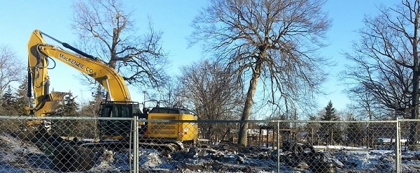 Park structure demolished, heavy equipment clearing the site