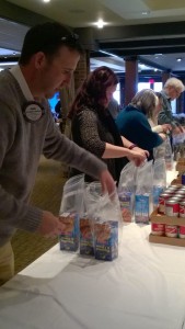 Rotarians and guests packing WSK at the Friend Raiser